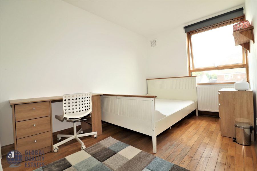 Bedroom with desk and chest of drawers