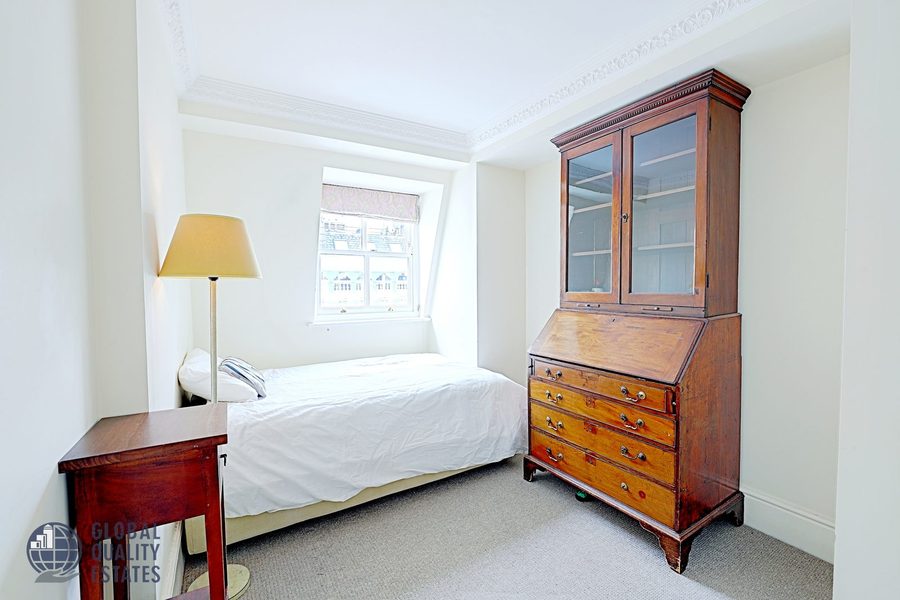 Second bedroom with antique bureau bookcase