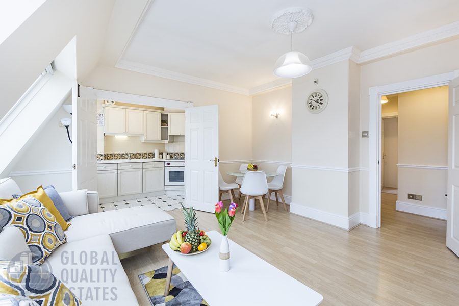 Reception room with dual skylights and open kitchen