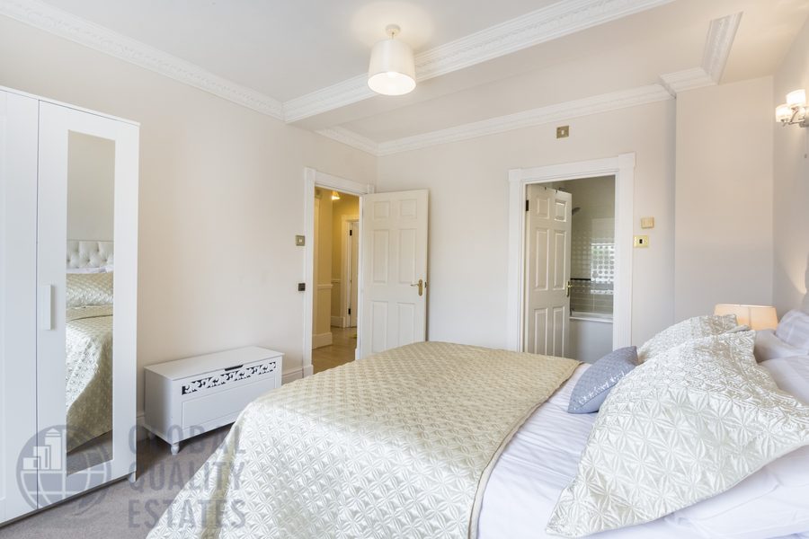 Principal bedroom with fitted wardrobe and en suite