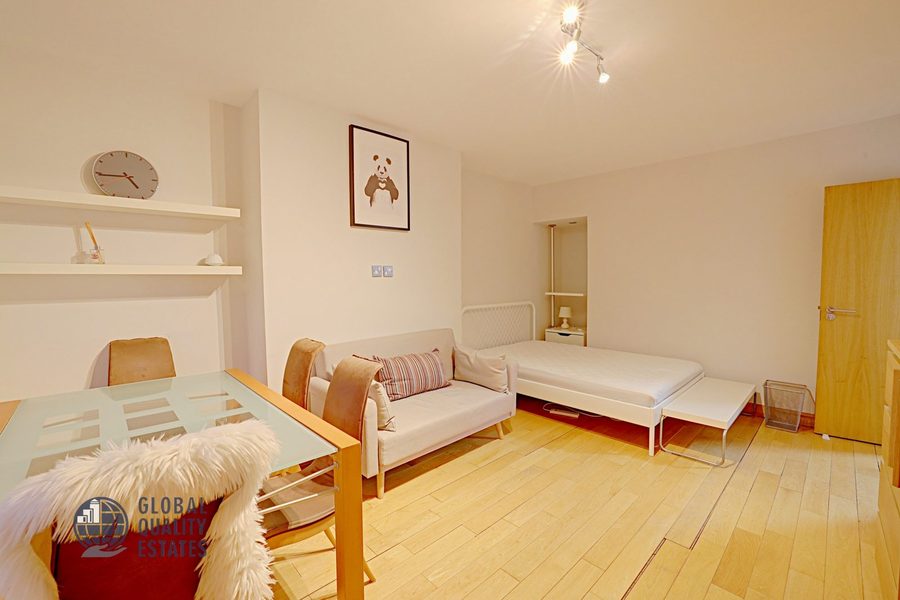 Bedroom with dining table and sofa area, additional view