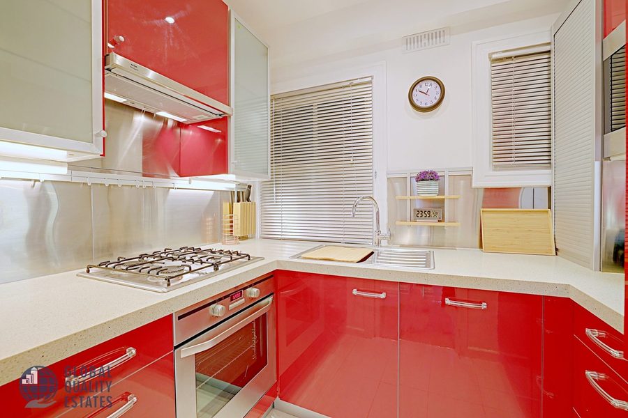 Kitchen with gas hob and stainless steel sink